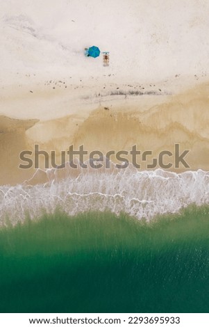 Aerial View From Flying Drone Of People Crowd Relaxing On Algarve Beach In Portugal