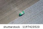 Aerial image of a six row Baler Cotton picker working in a field.