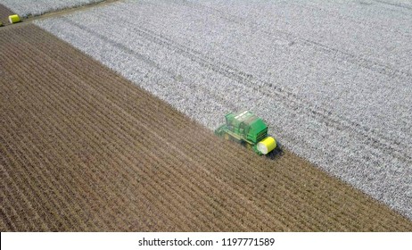 Aerial Image Of A Six Row Baler Cotton Picker Working In A Field.