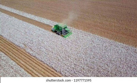Aerial image of a six row Baler Cotton picker working in a field.