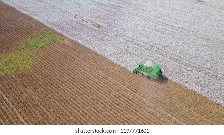 Aerial Image Of A Six Row Baler Cotton Picker Working In A Field.