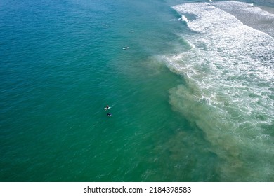 Aerial Image Of Tombo Beach, Located In The City Of Guarujá. Waves, Nature, Mountains And Bathers.