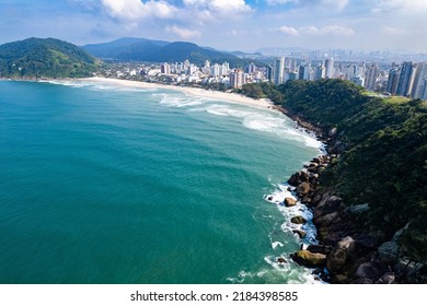 Aerial Image Of Tombo Beach, Located In The City Of Guarujá. Waves, Nature, Mountains And Bathers.