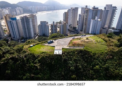 Aerial Image Of Tombo Beach, Located In The City Of Guarujá. Waves, Nature, Mountains And Bathers.