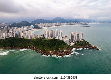 Aerial Image Of Tombo Beach, Located In The City Of Guarujá. Waves, Nature, Mountains And Bathers.