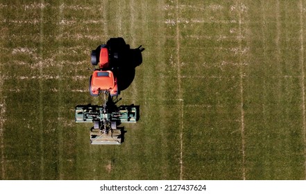 Aerial Image Of Tractor Mowing Grass