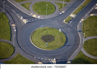 An aerial image of a traffic Island with circles around the outside