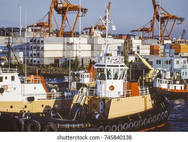 Aerial Image Of Tugboat And Loading Cranes At Dock Seattle, Washington, USA