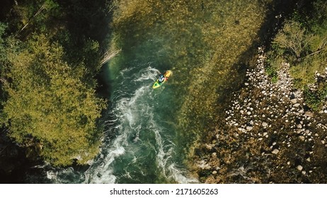 Aerial Kayaker Over A Mountain River Paddling Over Series Of Whitewater Rapids. Drone Shot