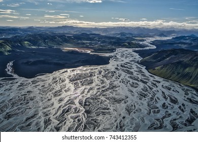 Aerial landscape of braided glacial rivers in mountains, Iceland
