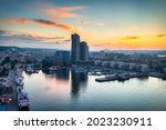 Aerial landscape of the harbor with modern architecture and Gdynia city inscription at sunset. Poland.