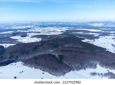 aerial landscape with hills and forests from Transylvania in winter