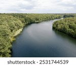 Aerial landscape of Krumme Lanke Lake during summer in Grunewald Forest in West Berlin Germany