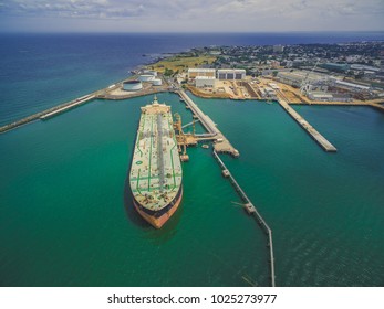 Aerial landscape of oil tanker moored at industrial port. Williamstown, Victoria, Australia