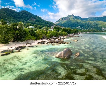 Aerial landscape overlooking the coastline of Mae Island in the Seychelles. Turquoise water of the Indian Ocean, tropical trees and beaches - Shutterstock ID 2226407719