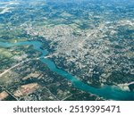 aerial landscape view of area around City of Mtwapa in Kenya, located north of Mombasa at east coast on Indian Ocean and Mtwapa Bridge crossing the Mtwapa Creek and cityscape from bird eyes view 
