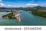 aerial landscape view of area around Rassada Pier, Rassada Harbour located south of Phuket town with Phuket Fishing Port, Marina and Phuket Marine Police station, Mountain Landscape in background