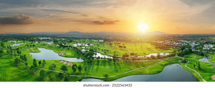 Aerial landscape view of expansive golf course featuring lush fairways. Bangkok, Thailand. Neatly arranged sand traps landscape, Several water bodies and rich canopy of trees. - Powered by Shutterstock