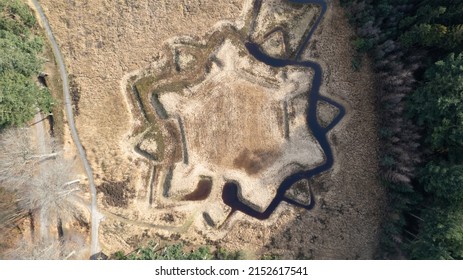 An Aerial Landscape View Of A Green European Pine Forest With Star Shape On A Sunny Day