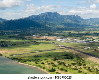 Aerial Landscape View Of The Mountain Tropical Coastline Beach Of Nadi Airport Runway, Fiji In The South Pacific