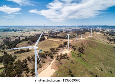 Aerial landscape of wind farm on a hill on bright sunny day in New South Wales, Australia