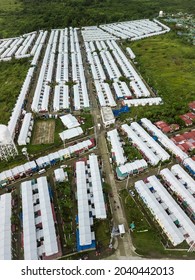 Aerial Of A Large Parcel Of Land Developed Into A Subdivision Of Rowhouses For Low To Middle Income Families. At Naic, Cavite, Philippines.