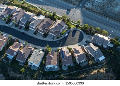 Aerial late afternoon view of suburban San Fernando Valley cul-de-sac street in Los Angeles, California.