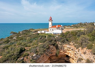 Aerial from lighthouse farol de Alfanzina on a cliff in the Algarve Portugal
