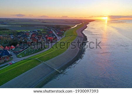 Aerial from the little village Wierum at sunset in Friesland the