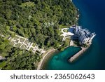 An aerial of the Miramare Castle in the scenic Gulf of Trieste in Italy captured on a bright day