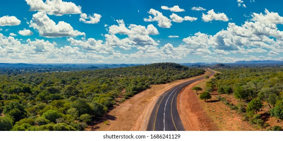 Aerial Of A New Build Road  Between The Green Hills In Botswana