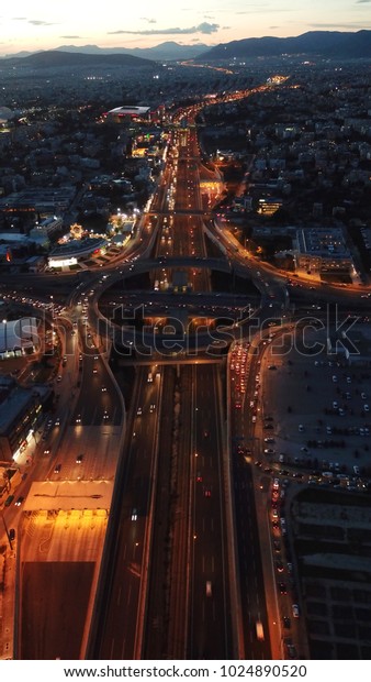Aerial night photo of ring road passing through\
city center