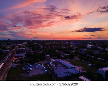 Aerial Night Time Drone Shot Of A Local Neighborhood In Chicago Near The Downtown City Area. The Streets Light Illuminate The City For A Beautiful View