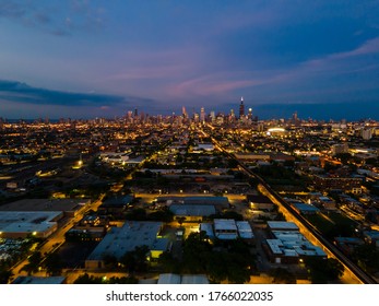 Aerial Night Time Drone Shot Of A Local Neighborhood In Chicago Near The Downtown City Area. The Streets Light Illuminate The City For A Beautiful View