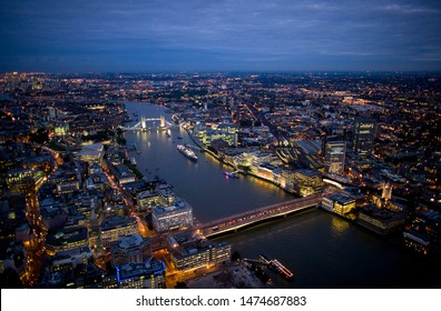 Aerial night view of Tower Bridge and London Bridge on August 6, 2007 in London - Shutterstock ID 1474687883