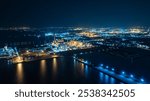 Aerial night view at world-class oil refinery, Petroleum refinery in the industrial factory of heavy industry zone, oil production plant, industrial process plant, oil storage tank.