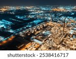 Aerial night view at world-class oil refinery, Petroleum refinery in the industrial factory of heavy industry zone, oil production plant, industrial process plant, oil storage tank.