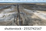 Aerial oblique image of salt flats with tidal river channel showing the contrast between wet and dry areas