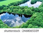 Aerial Oblique View of Dark Fishing Ponds Built from Former Sand Extraction Pits