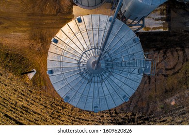 Aerial Overhead Shot Of Midwestern Farm Barn And Silos At Dusk