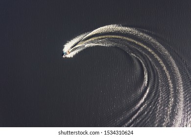 Aerial Overhead Shot Of A Small Motor Boat Turning, Taken In May 2019