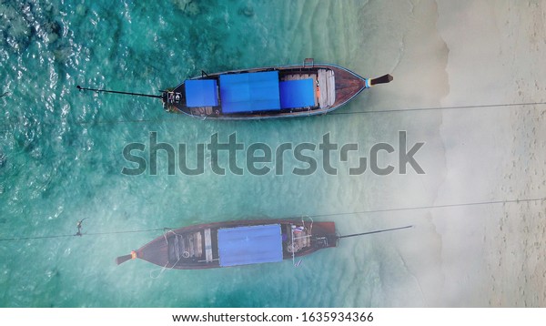 Aerial
overhead view of Long Tail Boats of
Thailand.