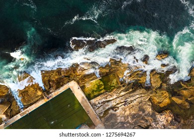 Aerial, Overhead View Of Waves, Rock Pool And A Rocky Shoreline In Sydney, Australia