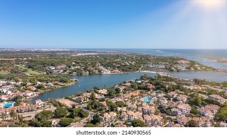 Aerial overview of luxury villas located around Quinta do Lago, Algarve, Portugal, Europe. Drone shot in the green zone. - Shutterstock ID 2140930565