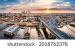 Aerial panorama with Ben Franklin Bridge and Philadelphia skyline at sunset. Ben Franklin Bridge is a suspension bridge connecting Philadelphia and Camden, NJ.