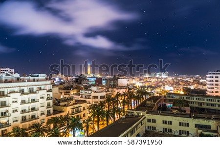 Aerial Panorama of Casablanca in Morocco at night. Illuminated Hassan II Mosque in the background