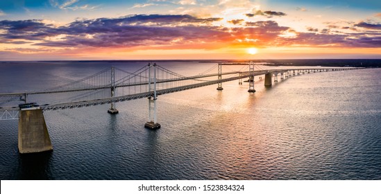 Aerial panorama of Chesapeake Bay Bridge at sunset. The Chesapeake Bay Bridge (known locally as the Bay Bridge) is a major dual-span bridge in the U.S. state of Maryland. - Shutterstock ID 1523834324
