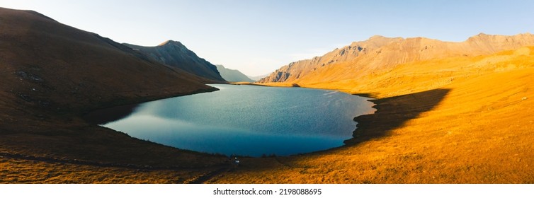 Aerial Panorama Close Up Blue Black Rock Lake Panorama In Scenic Evening Sunset Light Outdoors. Famous Travel Destination In Georgia. Hiking In Lagodekhi Concept