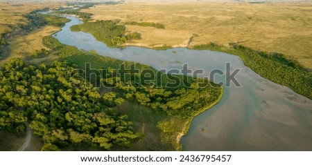 aerial panorama of the Dismal River meandering through Nebraska Sandhills at Nebraska National Forest, late summer scenery