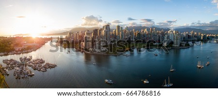 Aerial Panorama of Downtown City at False Creek, Vancouver, British Columbia, Canada. Taken during a bright sunset.